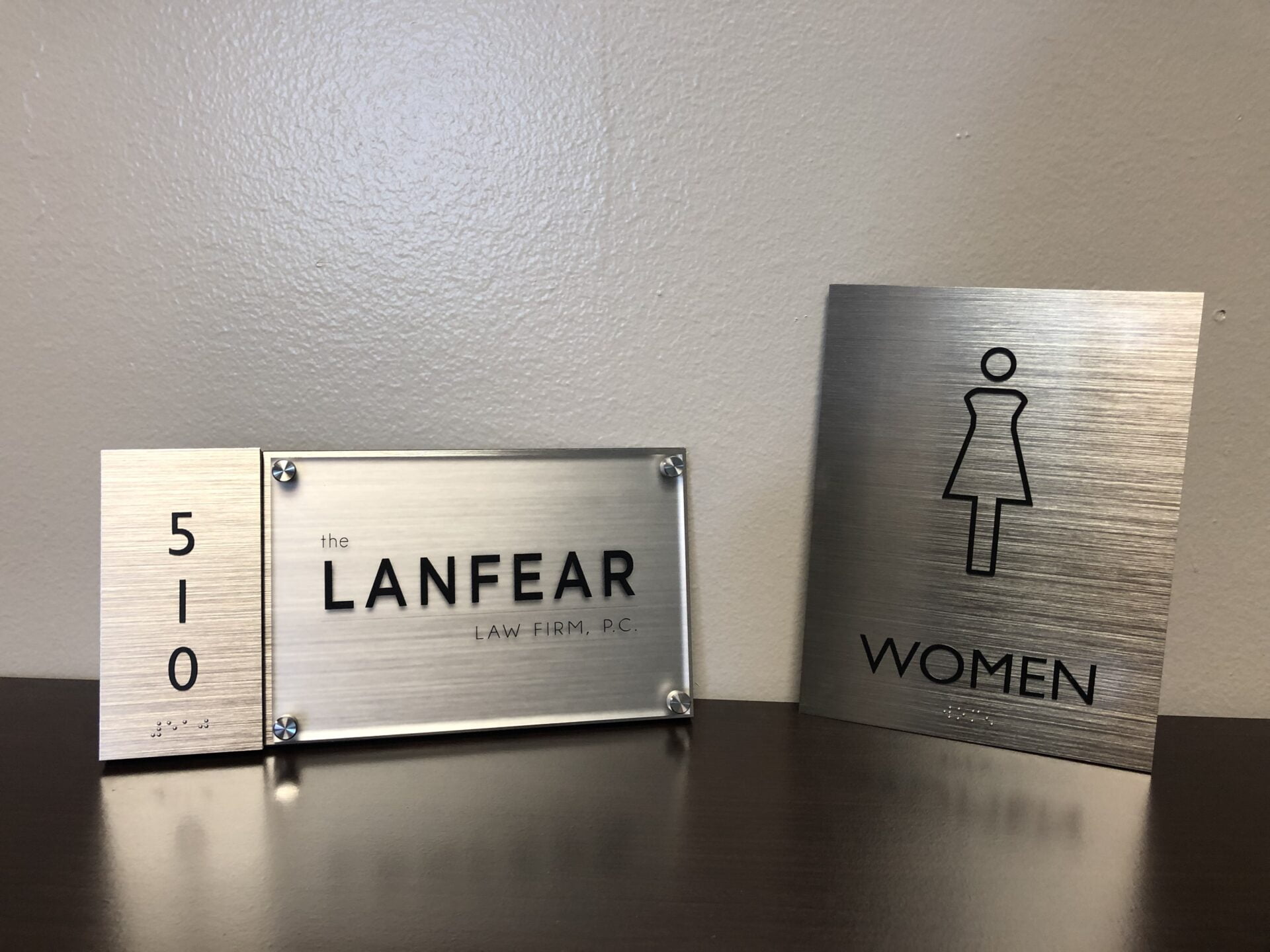 Metal interior signage for multi-tenant building in San Antonio