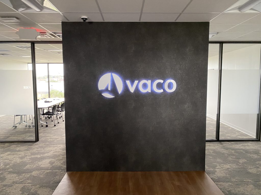 Office lobby with Vaco logo on wall