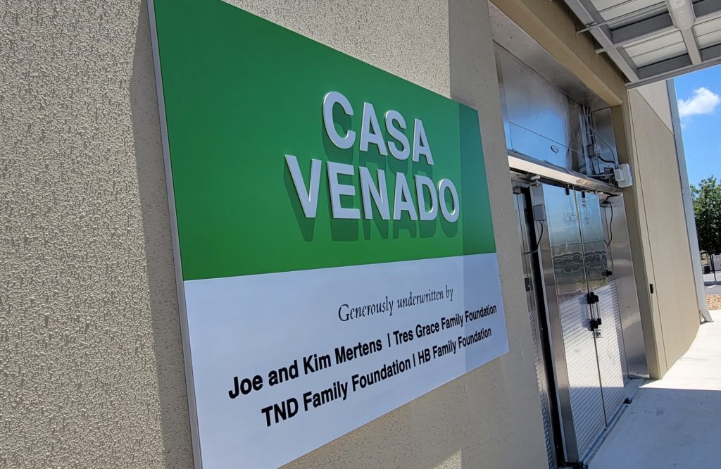 Casa Venado building exterior with donor recognition sign.