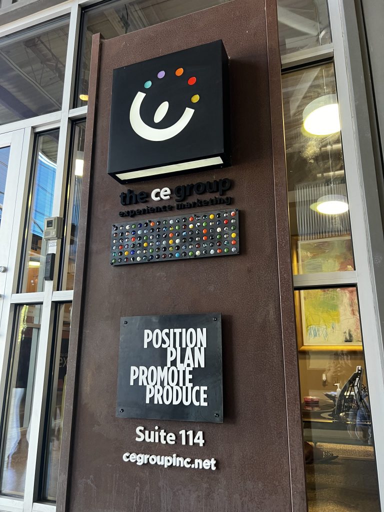 CE Group experience marketing office sign