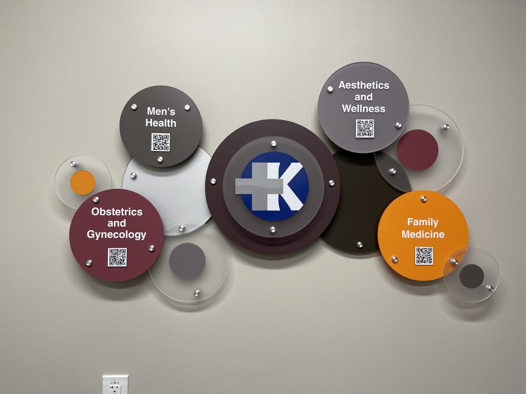 Healthcare services wall display with QR codes.