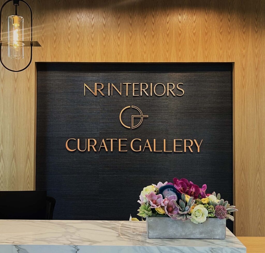 Reception area with modern decor and flowers.
